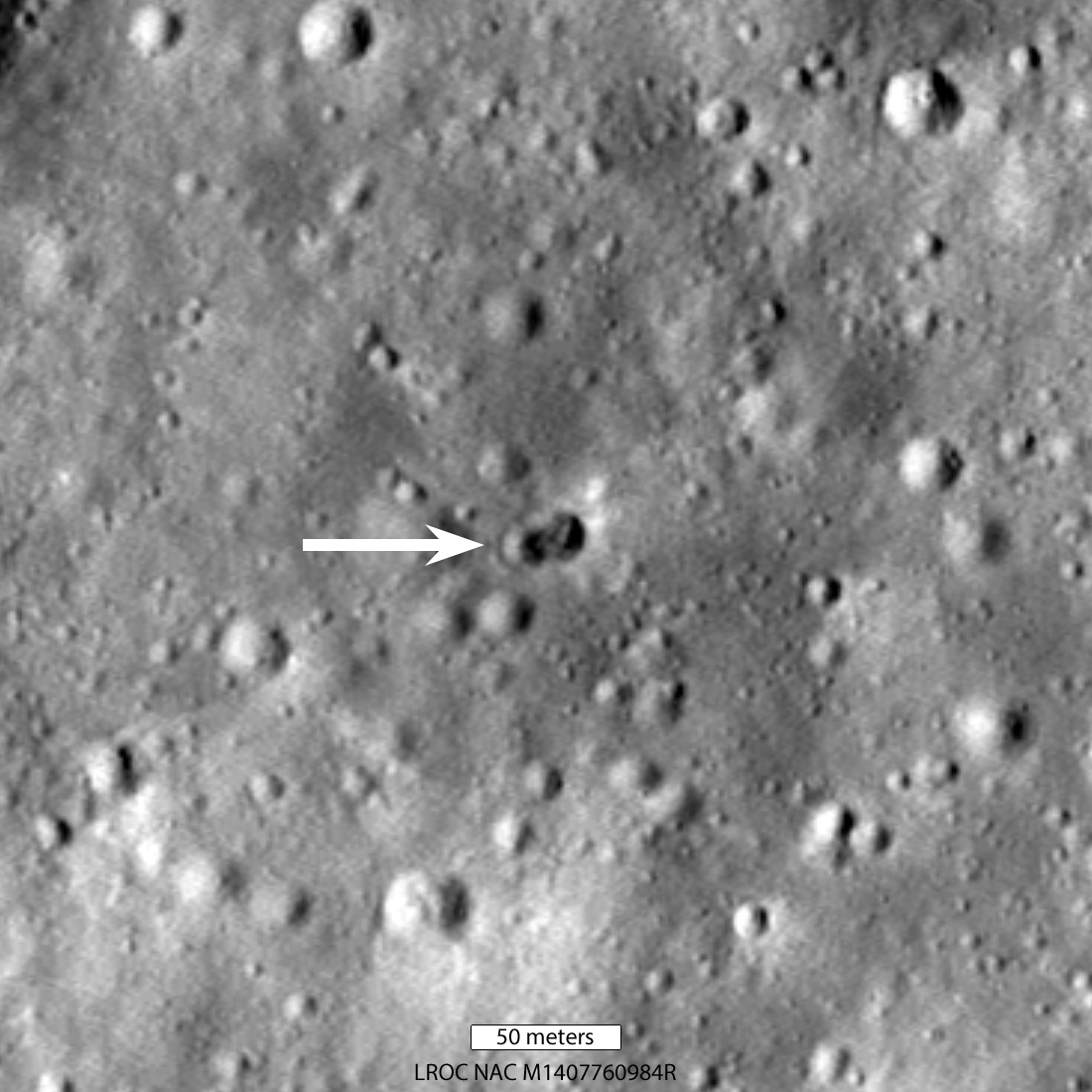 Grayscale lunar surface showing double crater from rocket body impact on the Moon, captured by NASA Lunar Reconnaissance Orbiter
